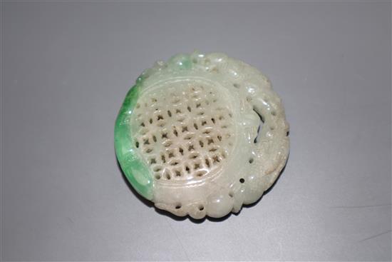 A carved jade plaque, diameter 5cm